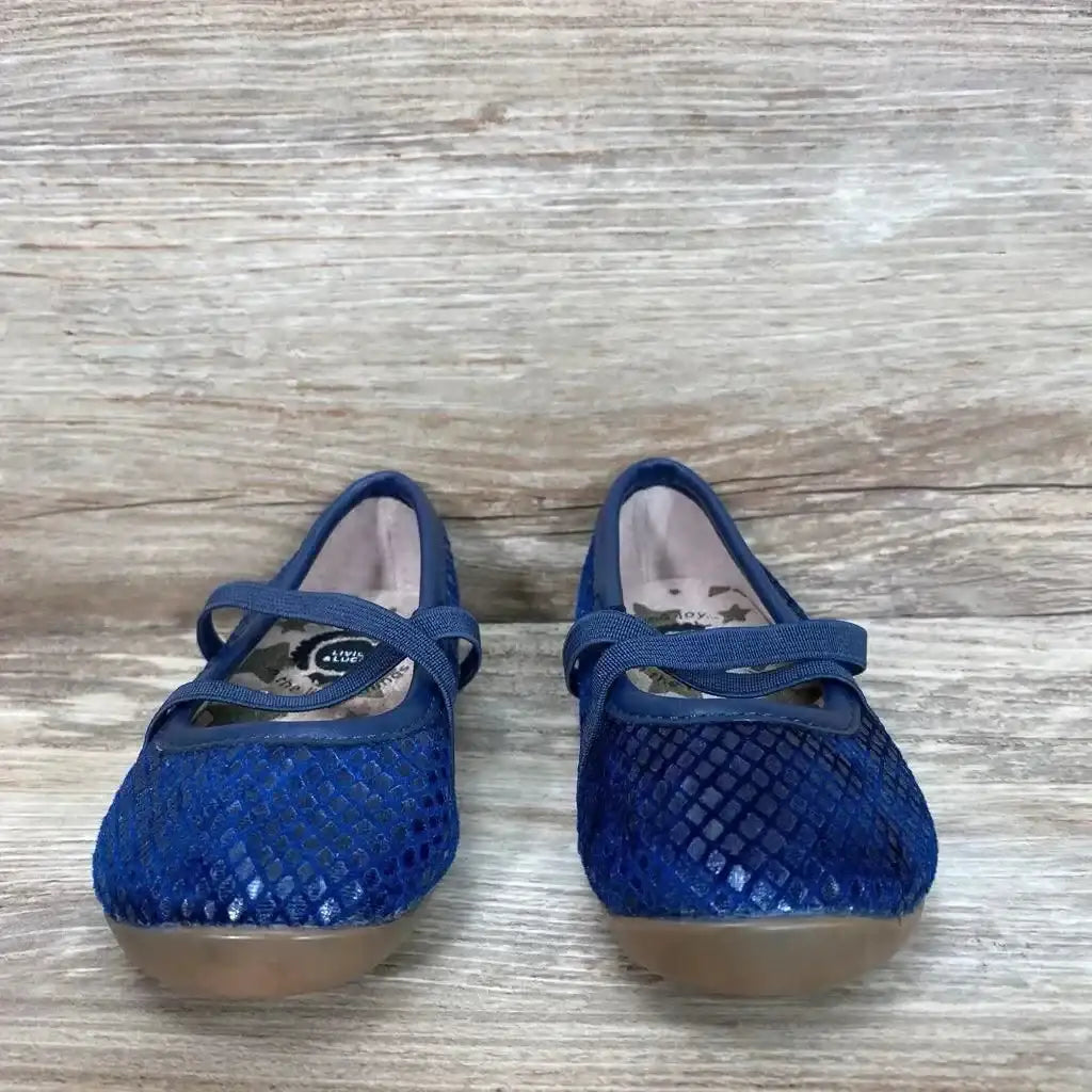 Front view of blue Livie & Luca toddler ballet flats showing diamond mesh upper, elastic cross strap, and tan rubber soles on a light wood background