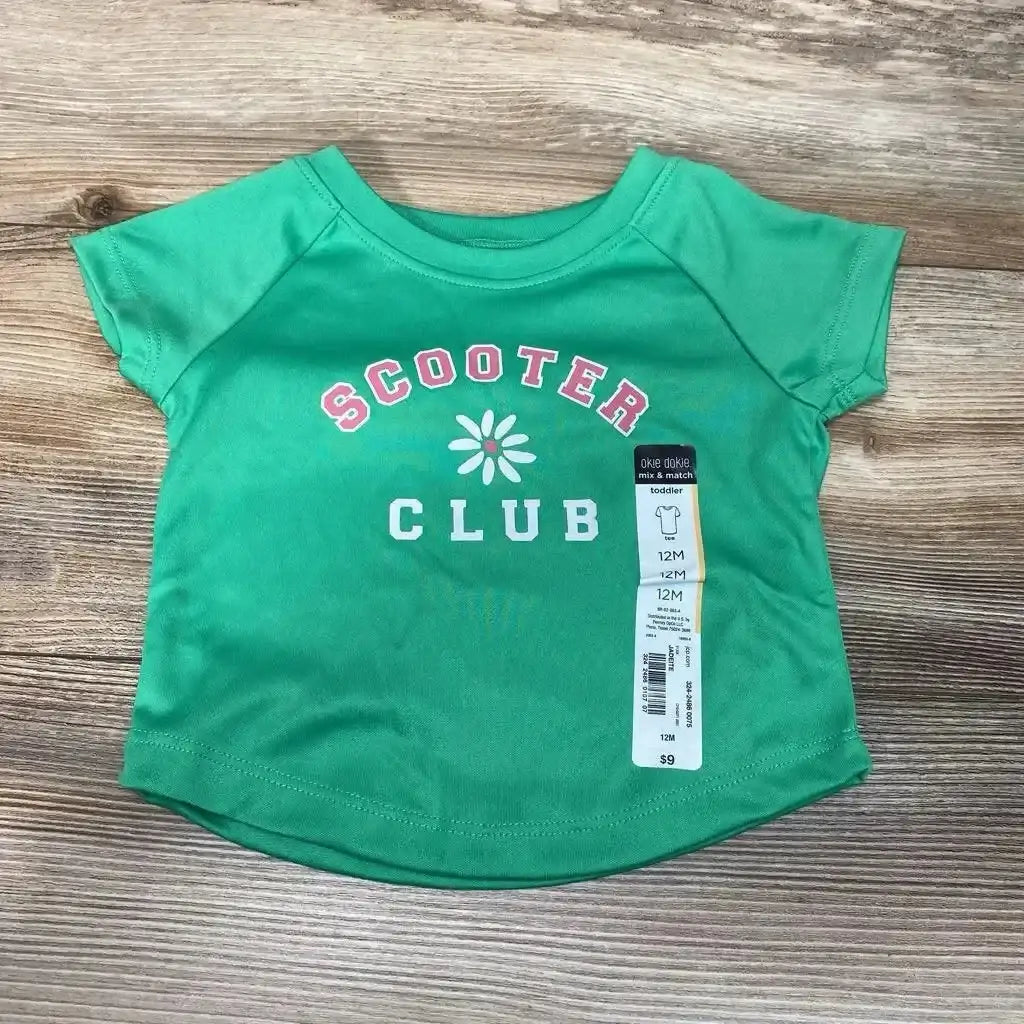 Front view of NEW Okie Dokie Scooter Club Shirt sz 12m with 100% polyester green fabric, Scooter Club graphic, and wood background