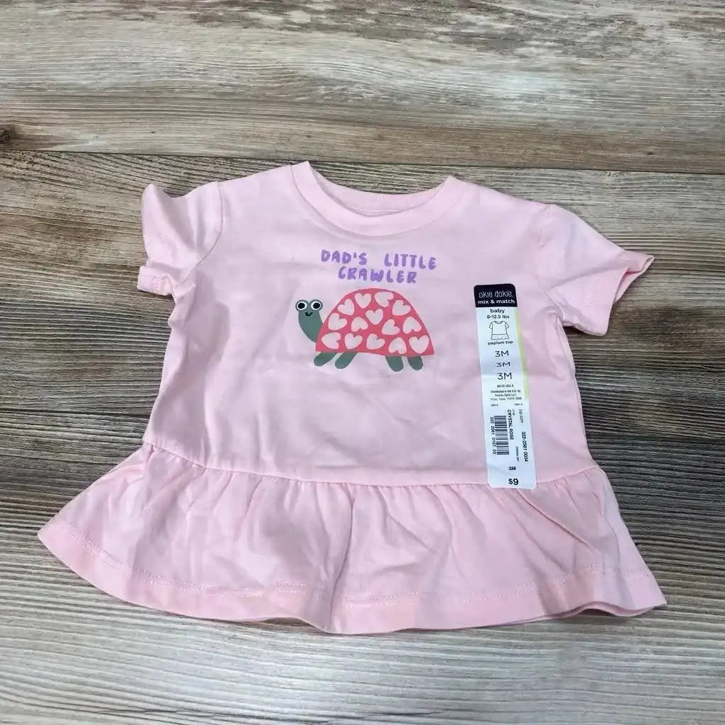 Front view of NEW Okie Dokie Dad’s Little Crawler peplum shirt, size 3M, in pink with turtle graphic and ruffled hem