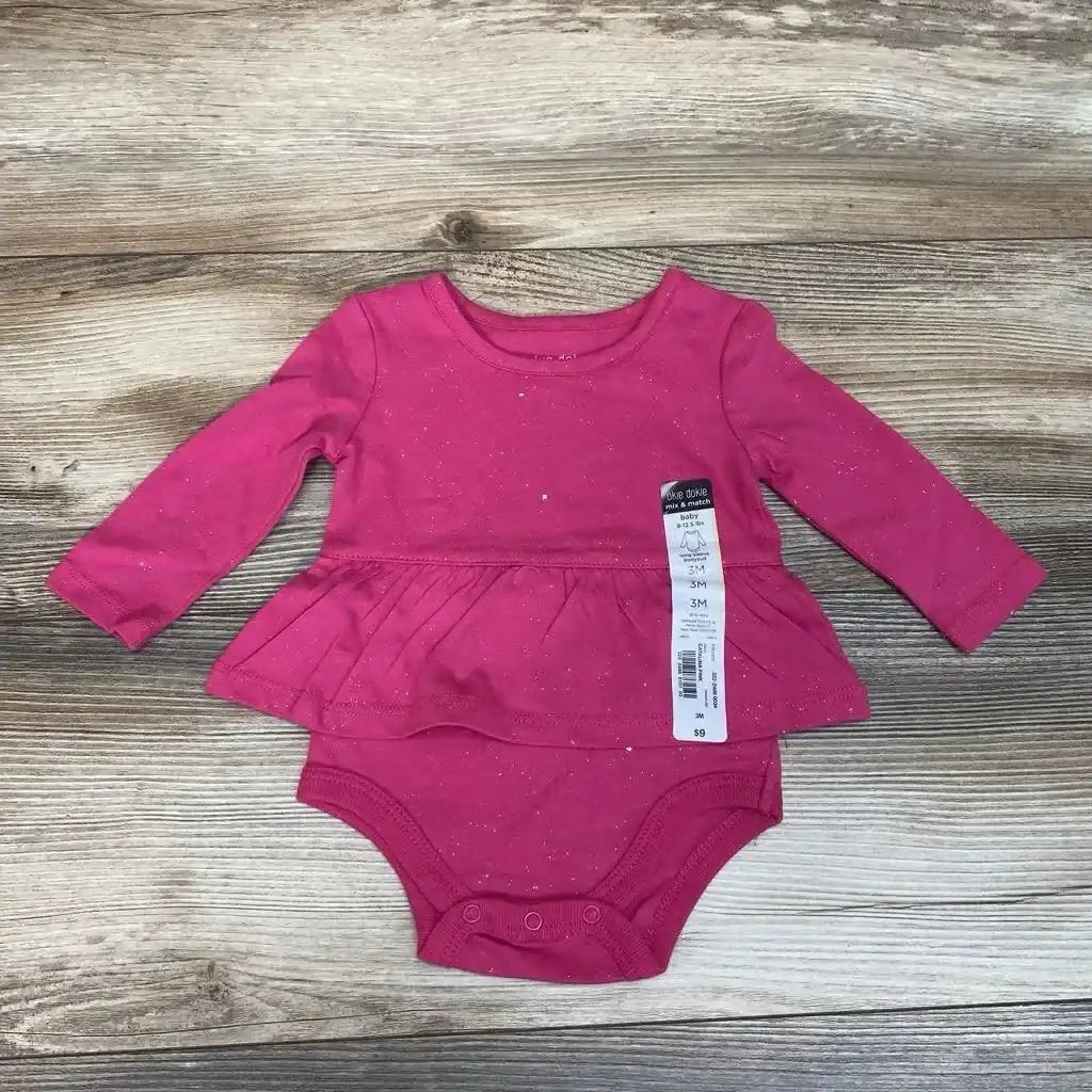 Front view of NEW Okie Dokie Skirted Bodysuit sz 3m showcasing pink long sleeves and attached skirt on a wood grain background