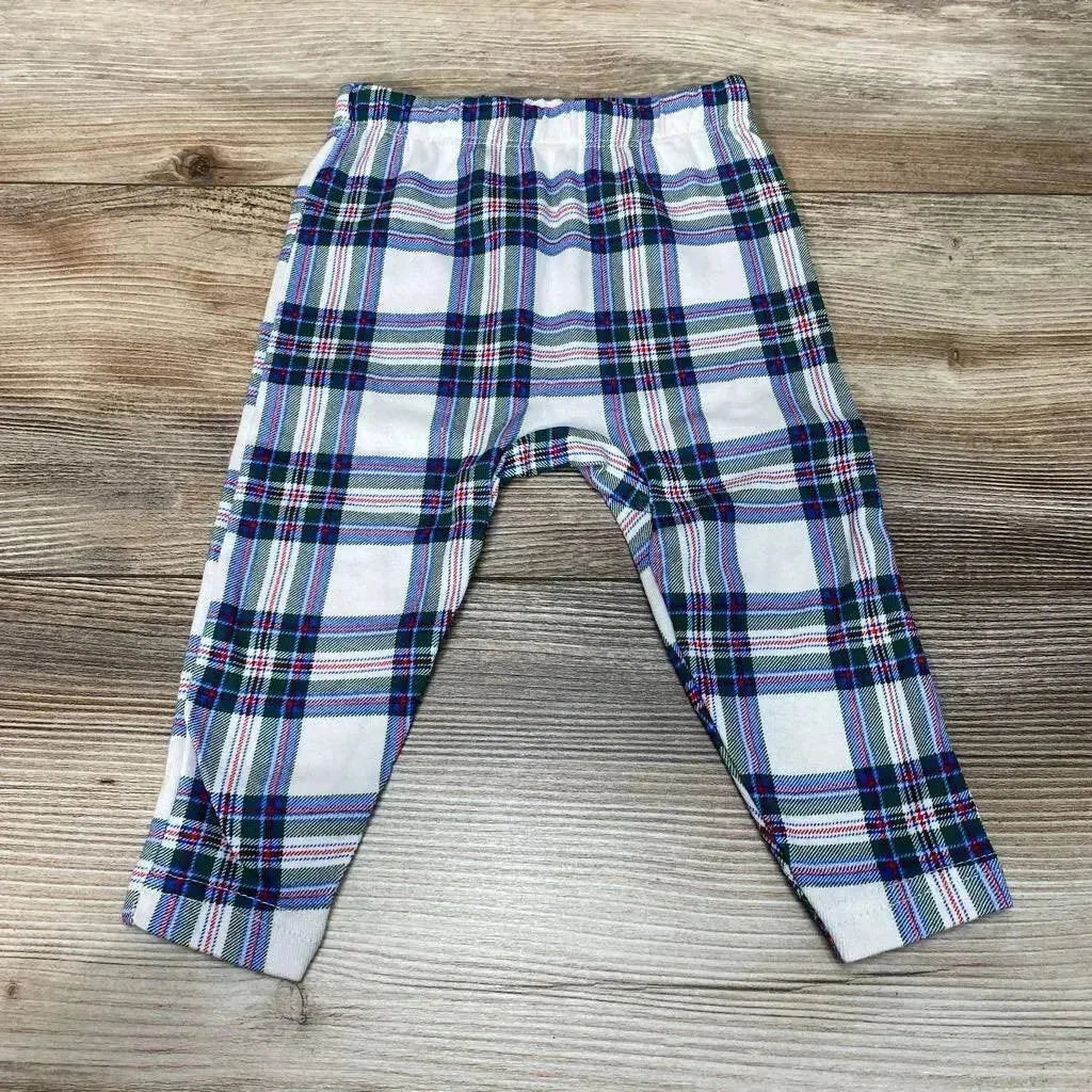 Front view of Okie Dokie plaid leggings sz 6m with blue, green, red, and white plaid pattern on a wood-grain background
