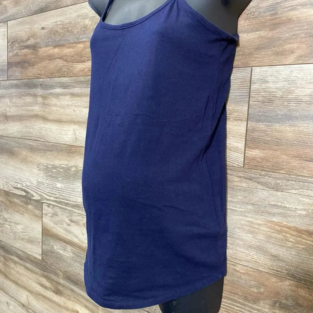 Side view of navy Motherhood Maternity tank with scoop neck, thin straps and fitted shape on mannequin with wood background