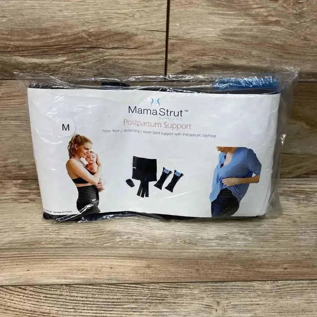 Front view of MamaStrut postpartum support brace, size M, packaged with therapeutic ice and heat packs on wood background