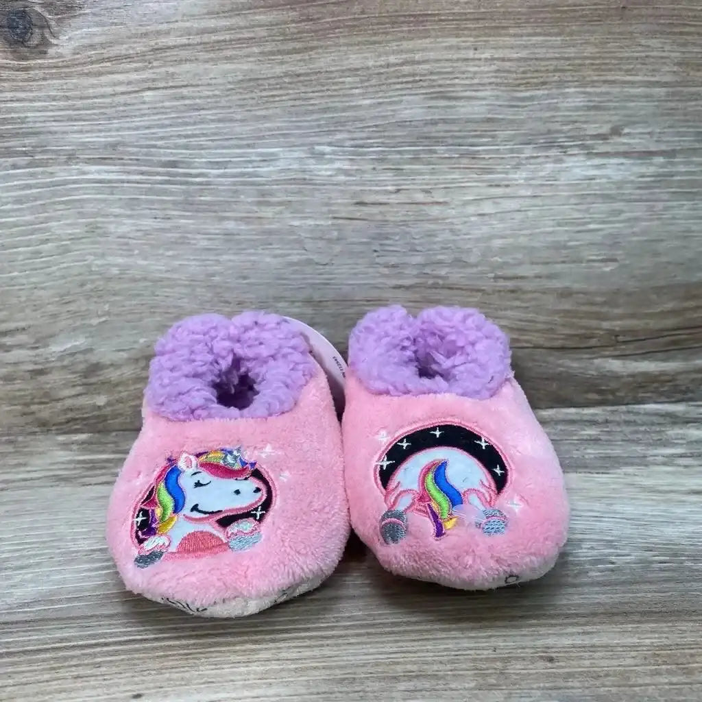 Front view of pink Snoozies Patch Pals slippers, size 5c/6c, with embroidered unicorn patches and purple lining on wood floor