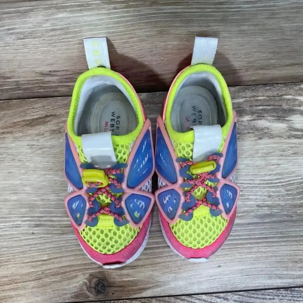 Side view of pink Sophia Webster Mini Chiara toddler sneakers showing butterfly wing appliques on white background