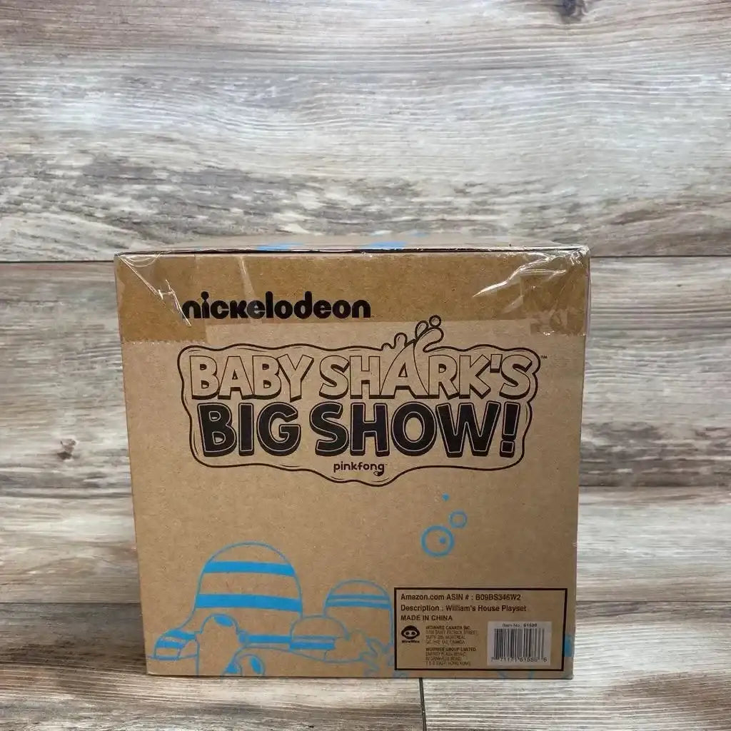 Front view of William's House playset box showcasing Baby Shark's Big Show logo and blue artwork on wood floor background