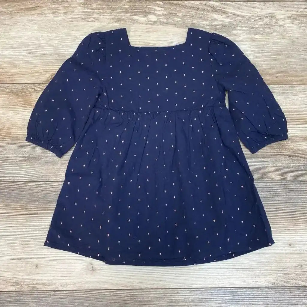 Flat lay of Baby Gap navy smocked dot dress, size 18-24 months, square neckline and long puff sleeves on wood background