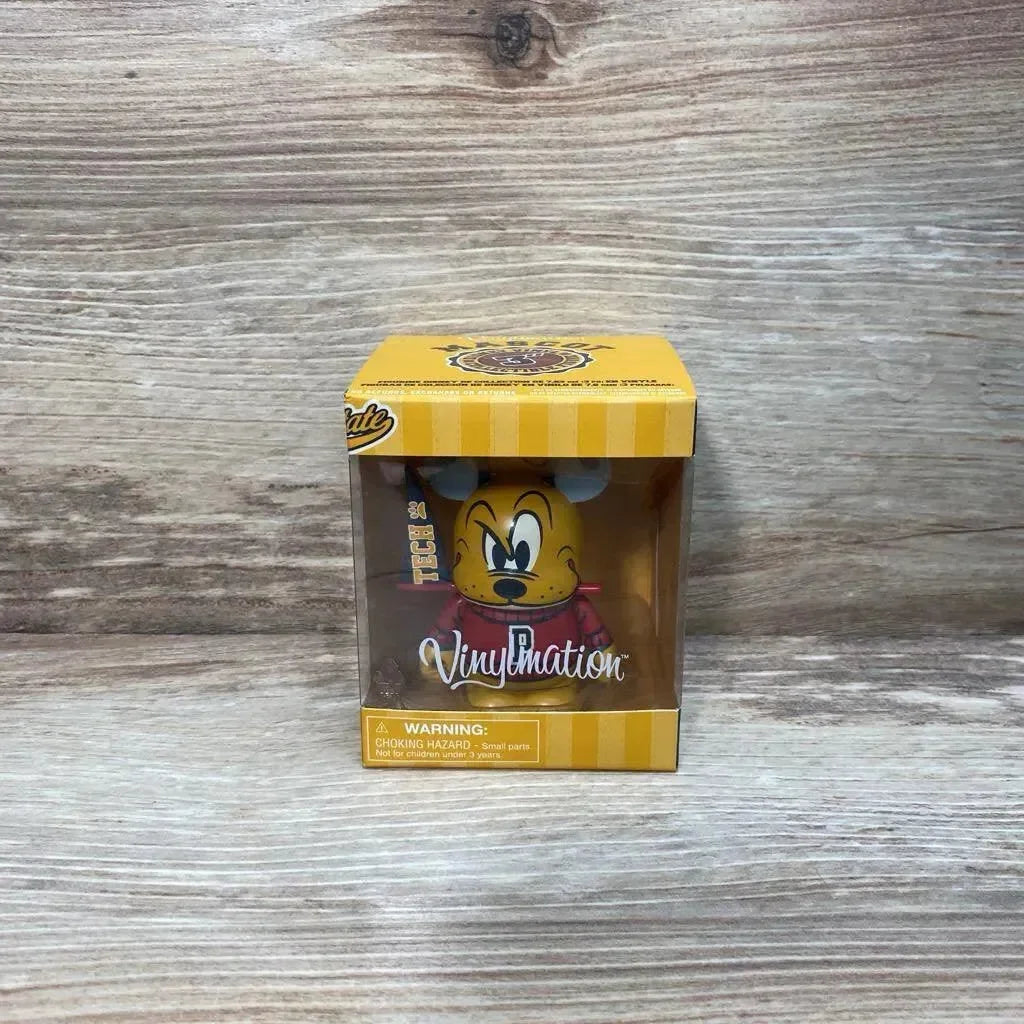 Front view of Vinylmation Pluto figure in yellow box showing Pluto face and Vinylmation logo on wood background