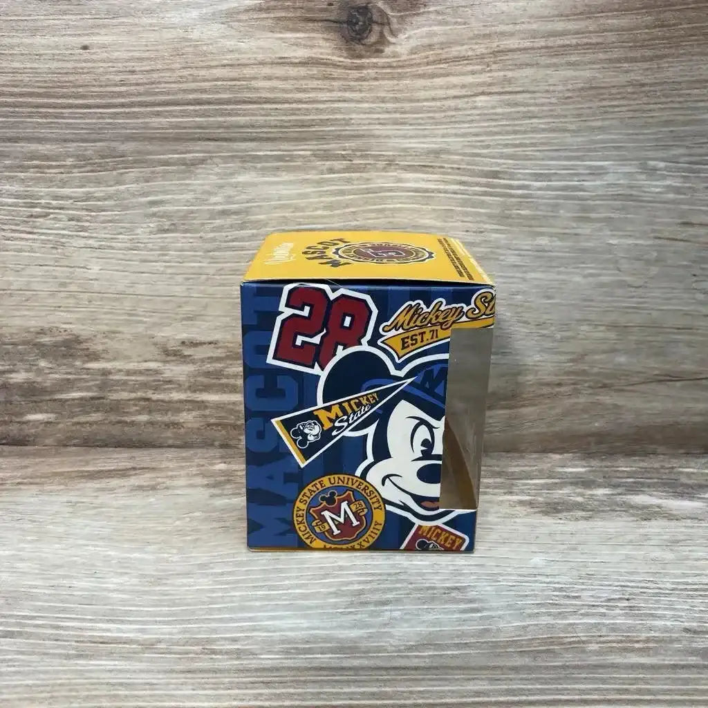 Front view of 3-inch Vinylmation Pluto figure showcasing yellow color and character details on white background