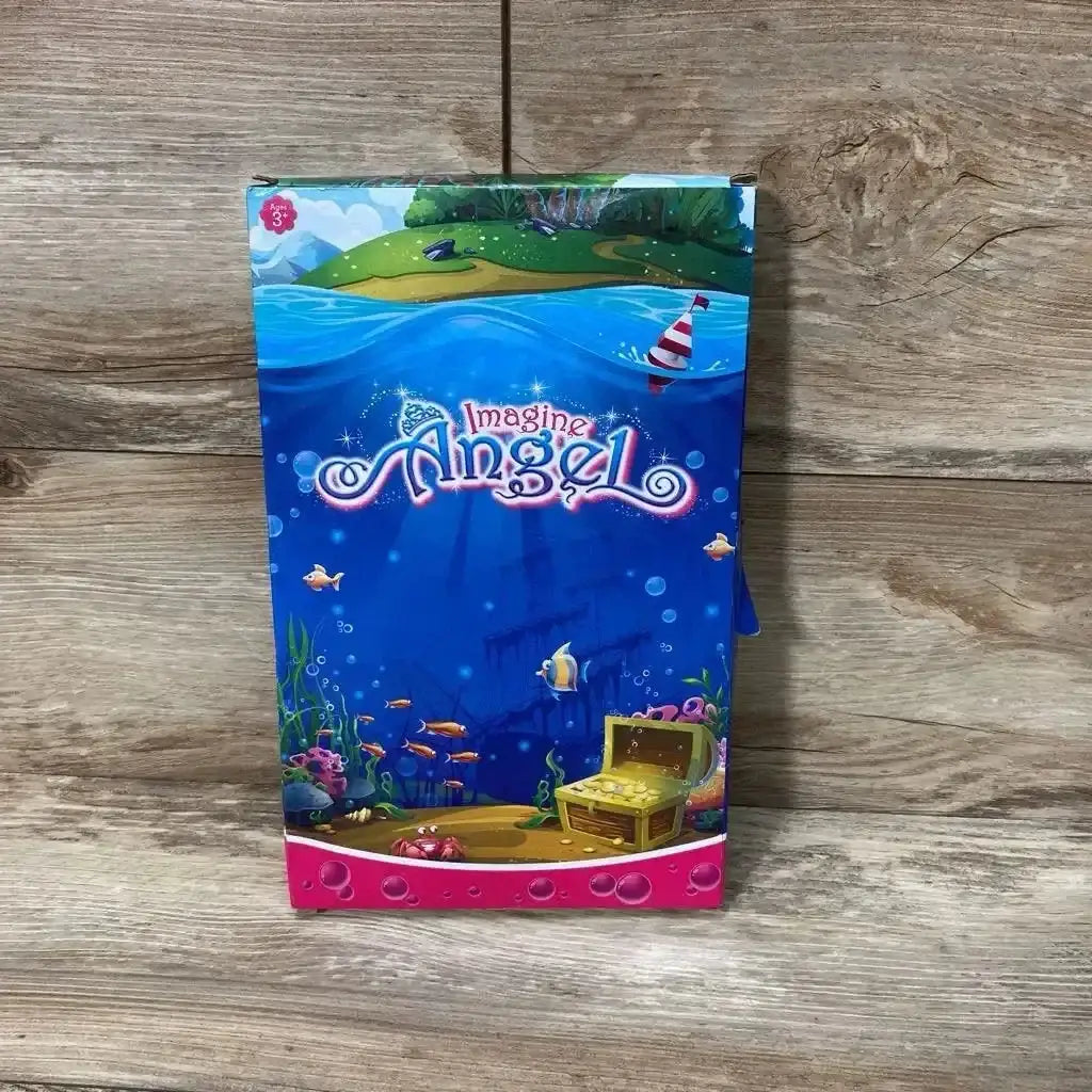 Front view of Imagine Angel 2-pack beach dolls boxed set showing underwater-themed artwork and treasure chest on wooden background