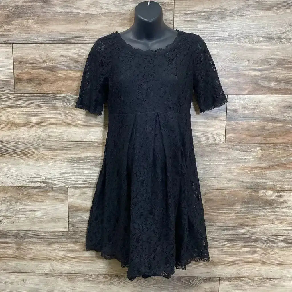 Front view of black lace fit-and-flare maternity dress showing lace overlay and short sleeves on white background