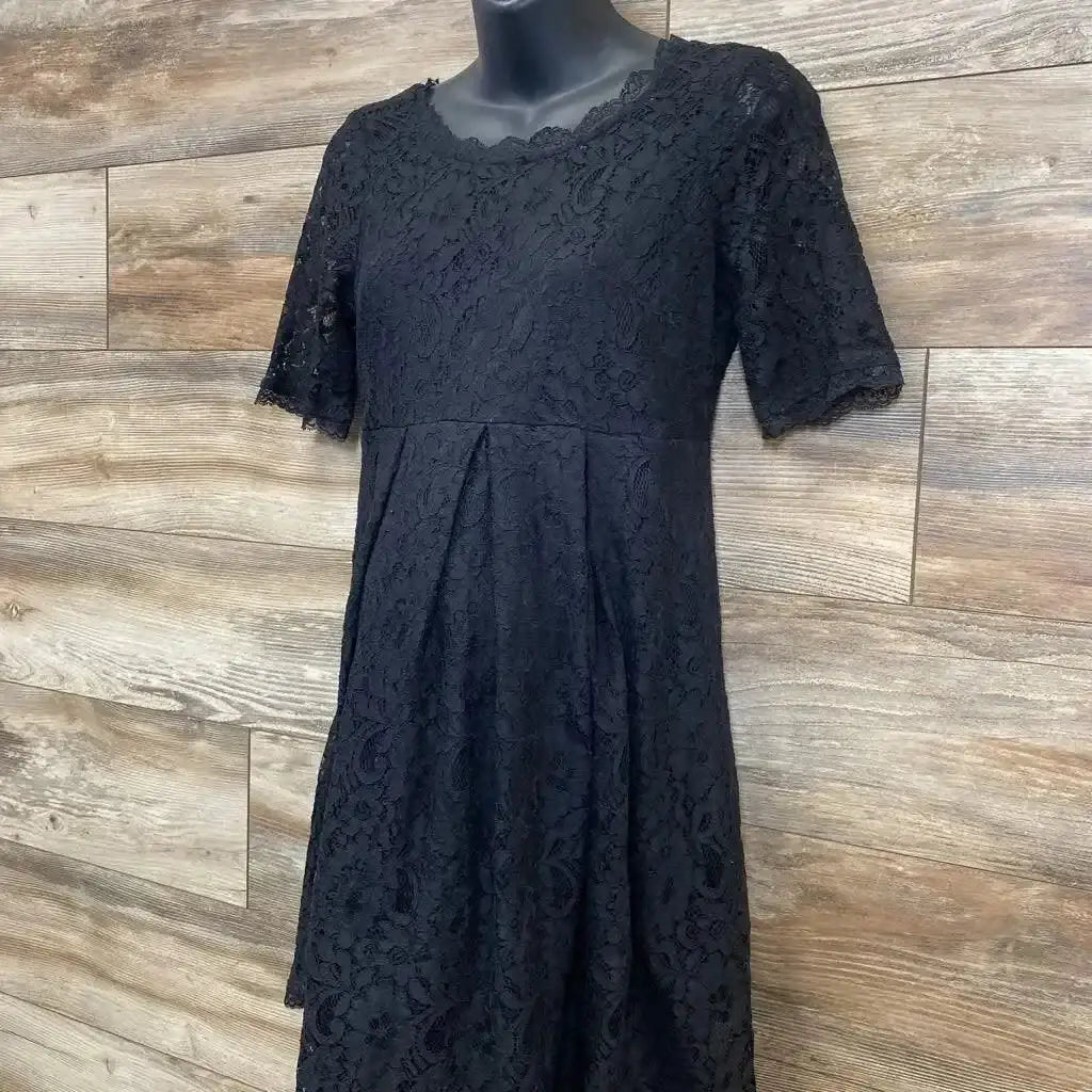Front view of black lace fit-and-flare maternity dress showing lace overlay and short sleeves on white background
