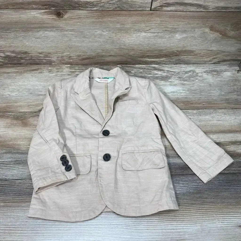 Flat lay of Cat & Jack blazer jacket size 2T showcasing beige linen weave notched lapel dark buttons and flap pockets on wood plank floor