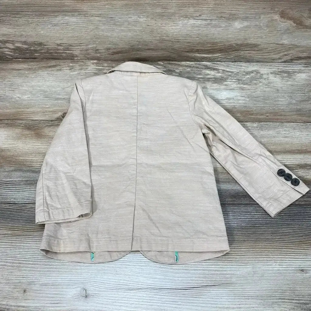 Back view of Cat and Jack blazer jacket showcasing beige linen blend fabric with notched collar and button cuffs on wood plank floor