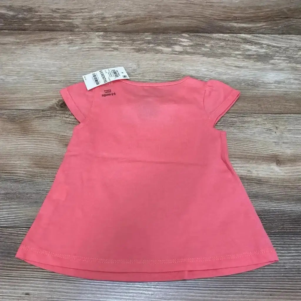 Front view of pink short-sleeve baby shirt showcasing pineapple graphic, size 6–9 months, on white background
