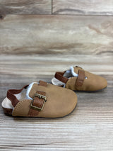 Brown toddler slip-on shoes with buckles and elastic heel straps on wood floor