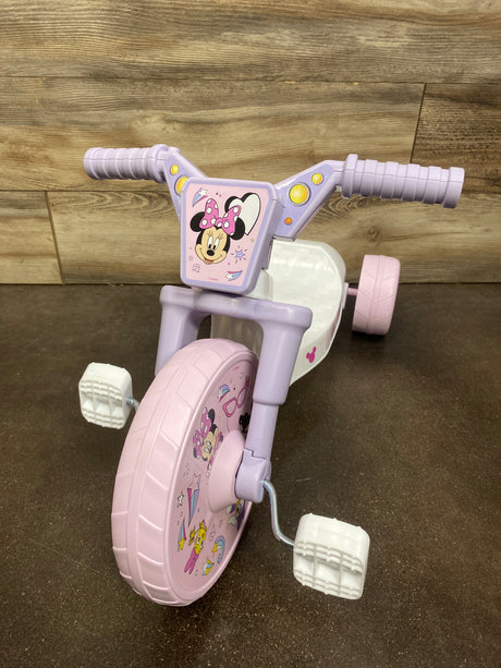Front three-quarter view of Minnie Mouse 10 inch Fly Wheels Cruiser Tricycle showcasing pink and white design on a wood floor