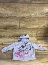Front view of a lilac Minnie Mouse full-zip hooded sweatshirt with character graphics and rounded-ear hood on wood flooring
