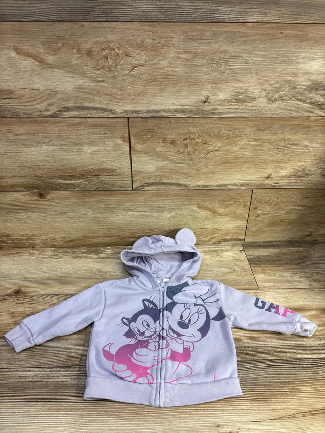 Front view of a lilac Minnie Mouse full-zip hooded sweatshirt with character graphics and rounded-ear hood on wood flooring