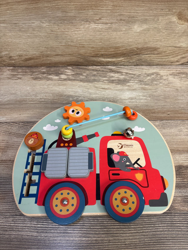 Top view of Classic World fire engine busy board with sliding ladder, bead maze, spinning gear, bell on wood surface