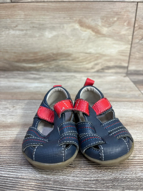 Front view of navy See Kai Run Fisherman toddler sandals size 3C showcasing red Velcro straps and textured toe on wood background