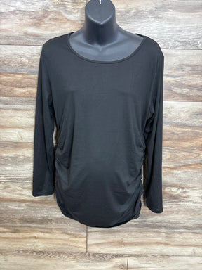 Black maternity long sleeve shirt with ruched sides on mannequin, wood background