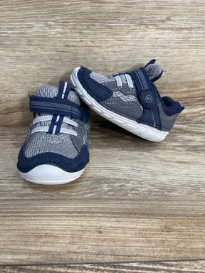 Front and side view of Stride Rite Kylo toddler sneakers in navy and gray showing mesh upper, Velcro strap, and white sole on wood background