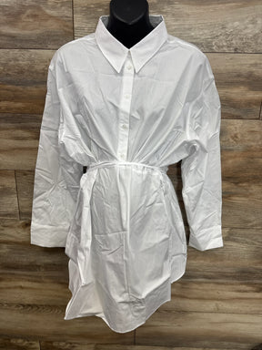 White maternity button-down shirt dress with tie waist, displayed on mannequin against wood background