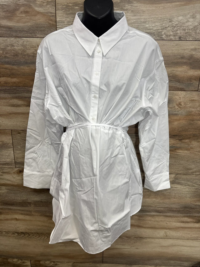 White maternity button-down shirt dress with tie waist, displayed on mannequin against wood background