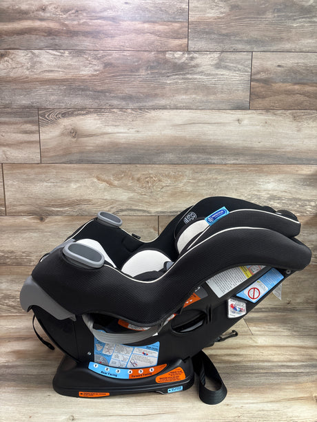 Side view of Graco Extend2Fit convertible car seat in Gotham showing cup holders and rear- and forward-facing positions