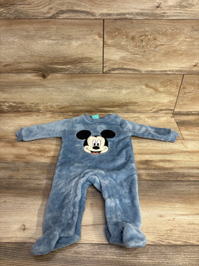 Blue fleece baby sleeper with cartoon mouse face on wooden background