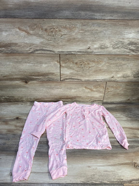 Flat lay of pink 2-piece swan-print toddler pajama set (4T) showing ruffled neckline and elastic-waist pants on wood floor