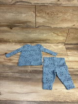 Just One You 2pc blue waffle knit shirt and pants set with floral print on a wooden background