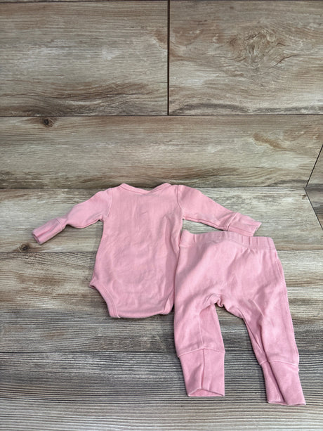 Little One Shop 2-piece pink Henley bodysuit and pants set for infants on a wood background