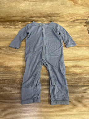 Gray long sleeve baby romper with snap buttons on wood background
