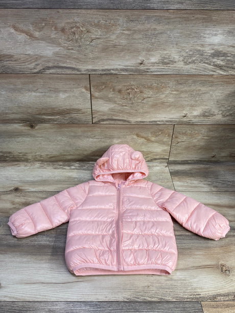 Front view of pink hooded puffer jacket, size 18 to 24 months, showing quilted padding and zip front on wood plank background