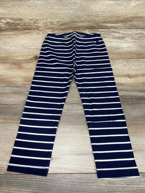 Flat lay of Baby Gap navy and white striped leggings with elastic waistband on wood floor, size 3T