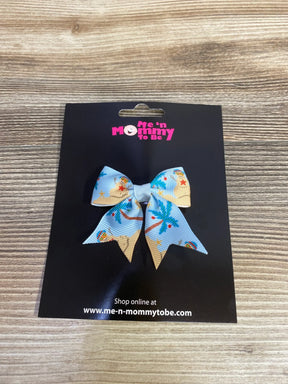 Beach-themed kids hair bow with palm trees and sand, perfect for summer outfits