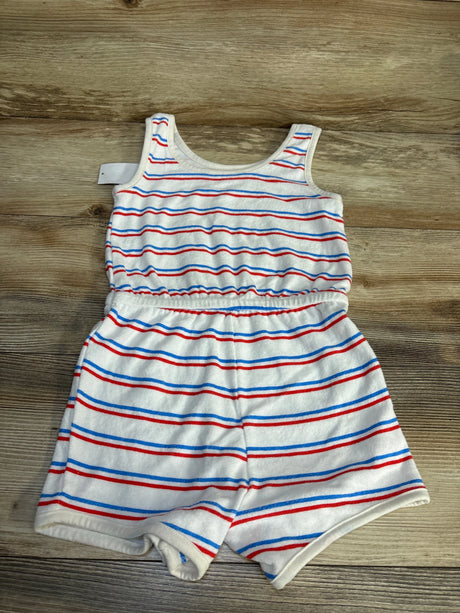 Sleeveless toddler romper with red, blue, and white stripes on wooden background