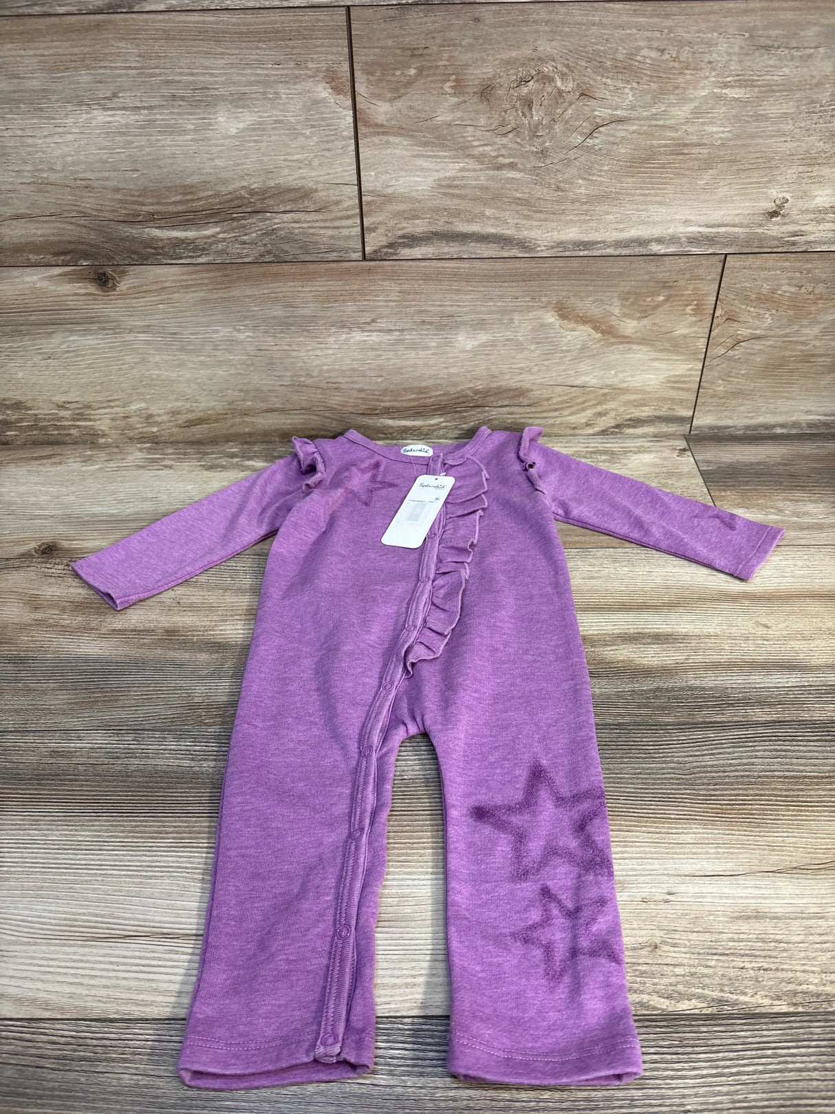 Purple baby romper with star prints and ruffle details, ideal for infants and toddlers.