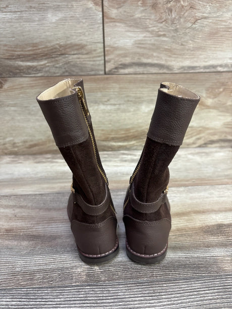 Front view of Janie and Jack brown riding boots showcasing side zippers and ankle straps on a wood floor