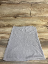 Light gray knit baby blanket displayed on wooden surface