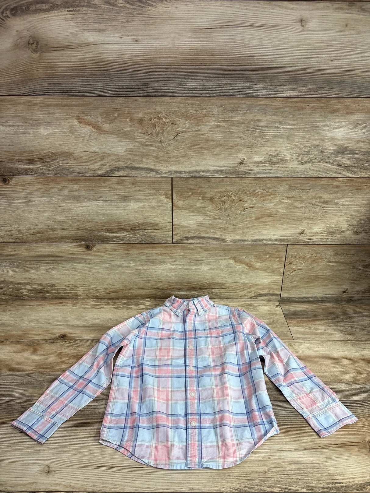 Flat-lay front of Janie & Jack toddler plaid poplin button-down shirt showing button front and collar on wood background, size 5T