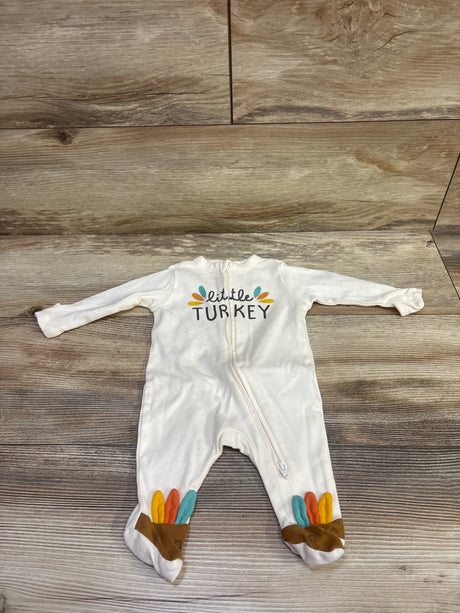 Front view of Old Navy Little Turkey sleeper showcasing turkey graphic, zipper, and turkey feet with wood-look background