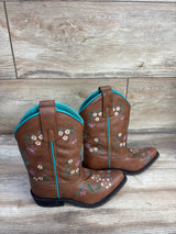 Side view of Shyanne brown floral embroidered western boots showing turquoise trim and multicolor embroidery on wood floor