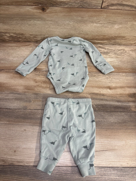 Gray baby long-sleeve onesie and pants set with dinosaur print on wooden floor