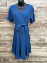 Blue maternity wrap dress with short sleeves, pleated skirt, and tie waist, displayed on mannequin