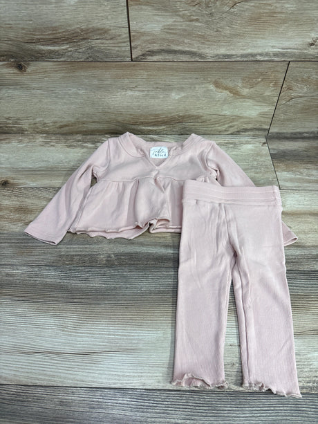 Fable & Ford pink ribbed long sleeve top and pants set for toddlers on a wood floor