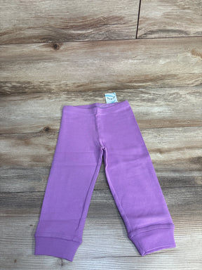 Purple baby leggings on wooden floor, soft cotton pants for infants, toddler clothing