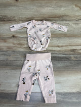 Light pink baby long sleeve bodysuit and matching pants set with Minnie Mouse print on wooden floor